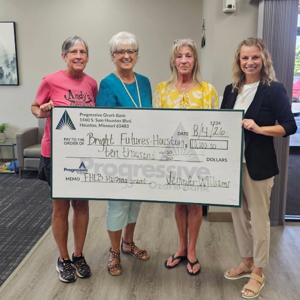 Bright Futures Houston receiving FHLB Impact Funds Check from Progressive Ozark Bank
