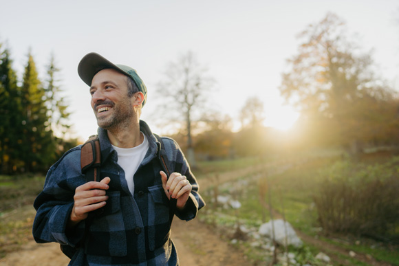 man wearing a backpack hiking