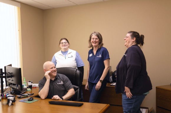 Salem Team Laughing in Office
