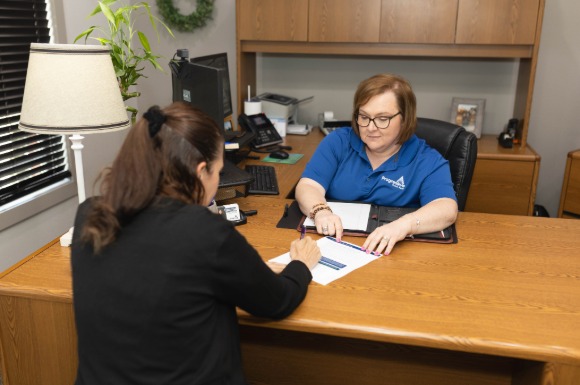 lender reviewing documents with customer
